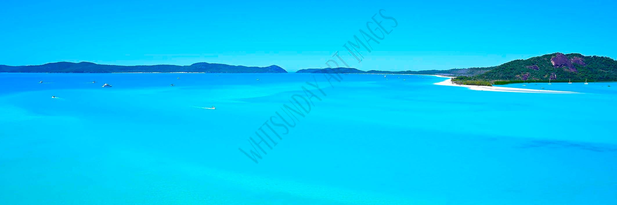 A sweeping panoramic view of Whitehaven Beach's swirling white sand and turquoise water from the Hill Inlet lookout.