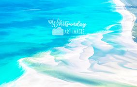 Aerial view of swirling turquoise water and pure white sand patterns at Whitehaven Beach.